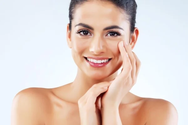 woman-cosmetics-pride-portrait-studio-happy-results-with-healthy-skin-blue-background-female-person-hands-face-skincare-beauty-glow-dermatology-wellness_590464-439983